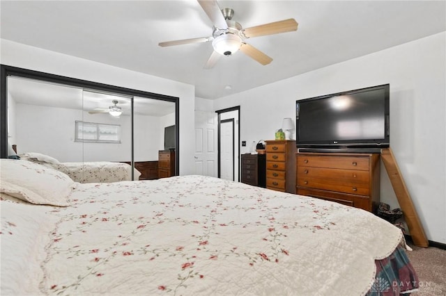 carpeted bedroom with a ceiling fan and a closet