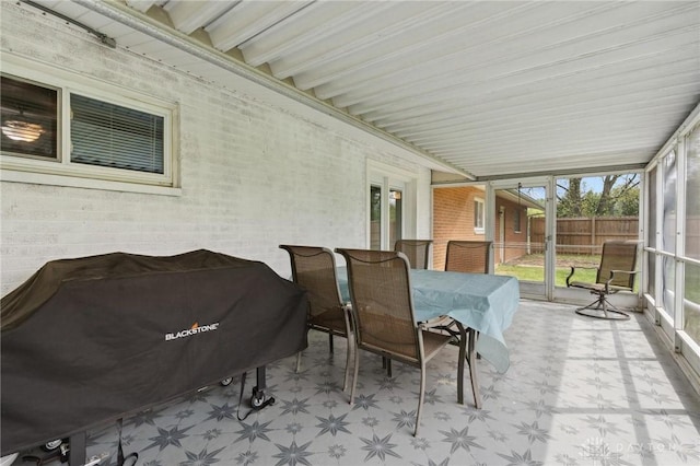 sunroom / solarium with outdoor dining space