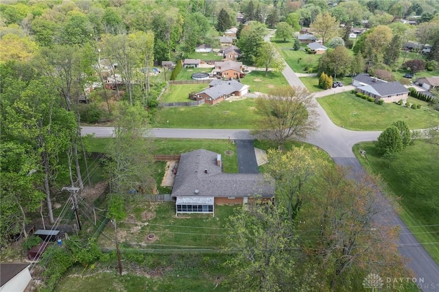 aerial view of property and surrounding area with nearby suburban area