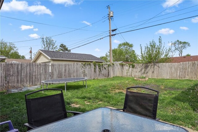 view of yard with a trampoline