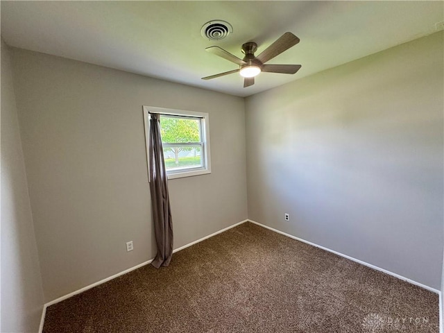 4832 Barnhart Ave, Dayton, OH 45432 - spare room featuring dark carpet, ceiling fan, and baseboards