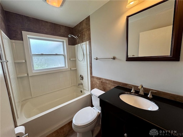 4832 Barnhart Ave, Dayton, OH 45432 - full bath with tile walls, shower / tub combination, toilet, vanity, and a wainscoted wall