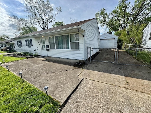 4832 Barnhart Ave, Dayton, OH 45432 - single story home featuring concrete driveway, fence, a detached garage, and an outbuilding