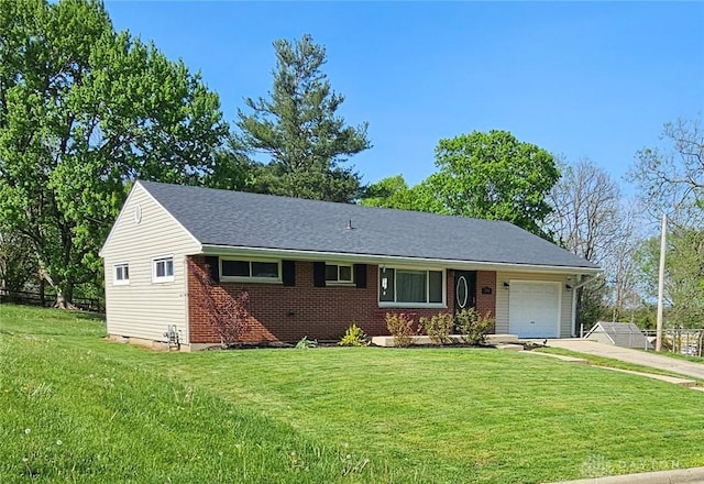 390 W Hendricks St, Camden, OH 45311 - view of front of house featuring a garage, driveway, and brick siding
