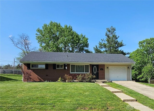 390 W Hendricks St, Camden, OH 45311 - single story home with a garage, concrete driveway, and brick siding