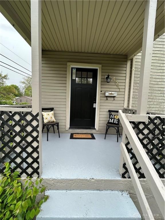 property entrance with covered porch