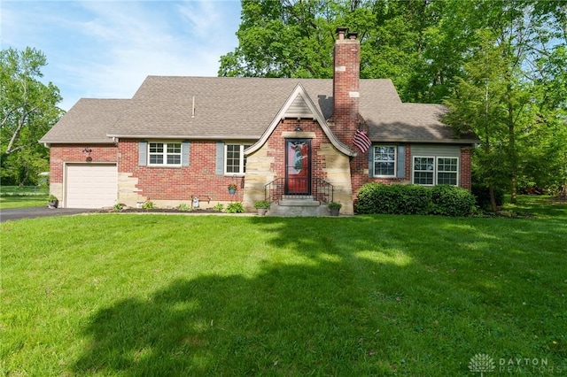 2182 La Grange Rd, Beavercreek, OH 45431 - tudor home with a garage, a chimney, a front lawn, and asphalt driveway