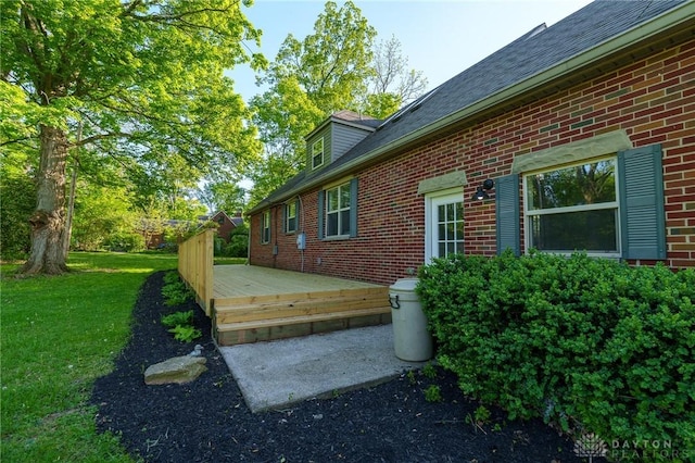 2182 La Grange Rd, Beavercreek, OH 45431 - view of property exterior with brick siding, a wooden deck, a shingled roof, and a yard