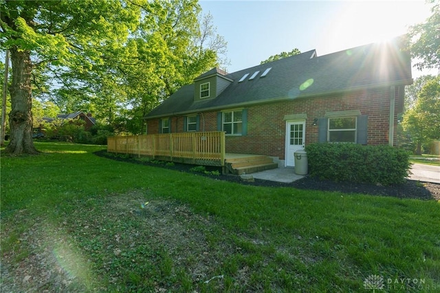 2182 La Grange Rd, Beavercreek, OH 45431 - back of house with brick siding, a yard, and a deck