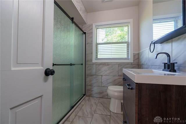2182 La Grange Rd, Beavercreek, OH 45431 - bathroom with tile walls, vanity, toilet, an enclosed shower, and marble finish floors
