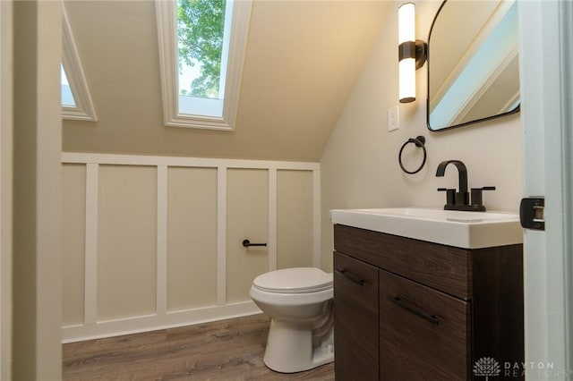 2182 La Grange Rd, Beavercreek, OH 45431 - half bathroom with vanity, wood finished floors, and vaulted ceiling