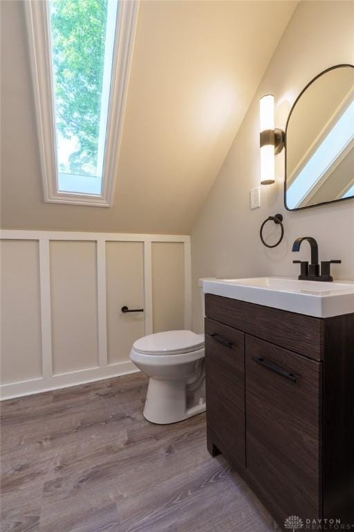 2182 La Grange Rd, Beavercreek, OH 45431 - bathroom featuring vanity, wood finished floors, and vaulted ceiling