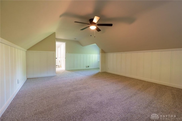 2182 La Grange Rd, Beavercreek, OH 45431 - additional living space with a decorative wall, carpet floors, vaulted ceiling, a ceiling fan, and a wainscoted wall