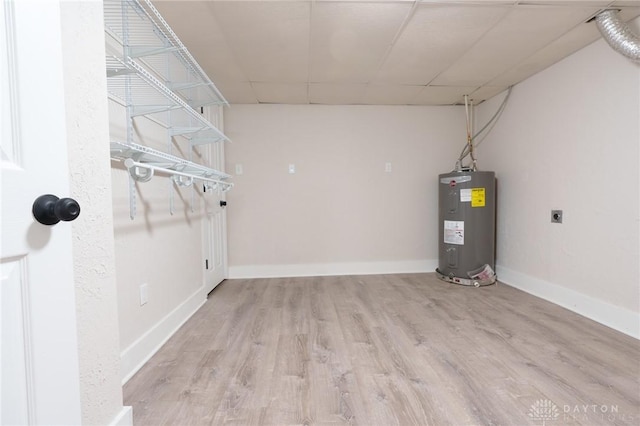 2182 La Grange Rd, Beavercreek, OH 45431 - finished basement with water heater, wood finished floors, a drop ceiling, and baseboards