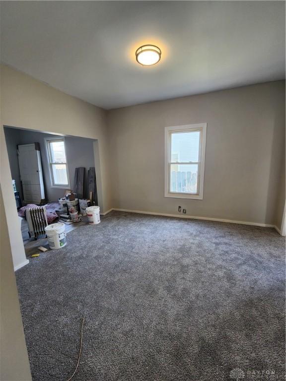 35 Utah Ct, Dayton, OH 45410 - unfurnished living room with carpet flooring and baseboards