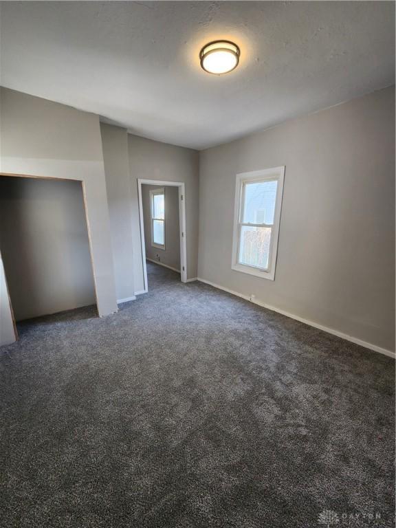 35 Utah Ct, Dayton, OH 45410 - unfurnished bedroom featuring carpet floors and baseboards
