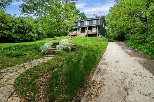 1803 Resor Rd, Fairfield, OH 45014 - view of yard with stairway, a porch, and driveway