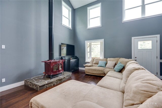 1803 Resor Rd, Fairfield, OH 45014 - living room with a wood stove, high vaulted ceiling, dark wood finished floors, and baseboards