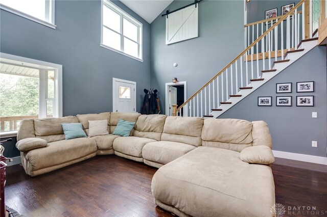 1803 Resor Rd, Fairfield, OH 45014 - living room with high vaulted ceiling, hardwood / wood-style floors, healthy amount of natural light, and a barn door