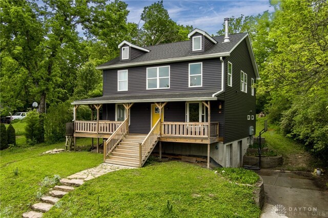 1803 Resor Rd, Fairfield, OH 45014 - view of front of property featuring a porch, a front lawn, concrete driveway, a shingled roof, and a garage