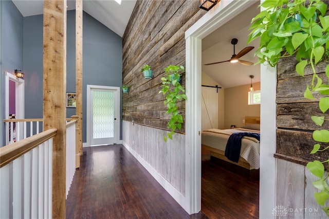 1803 Resor Rd, Fairfield, OH 45014 - hall with a barn door, high vaulted ceiling, wood finished floors, wood walls, and baseboards