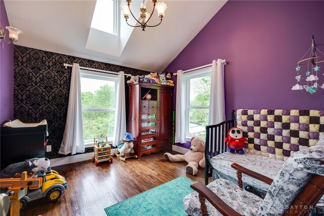 1803 Resor Rd, Fairfield, OH 45014 - bedroom with multiple windows, lofted ceiling, wood finished floors, a chandelier, and a skylight