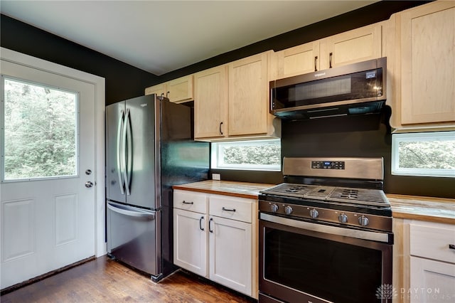 1803 Resor Rd, Fairfield, OH 45014 - kitchen featuring appliances with stainless steel finishes, wooden counters, dark wood-style floors, and healthy amount of natural light