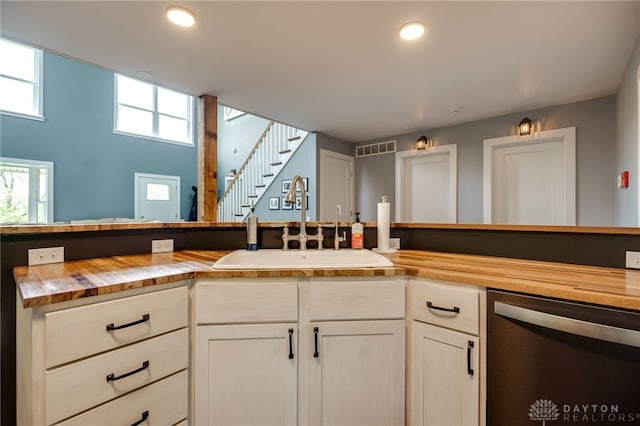 1803 Resor Rd, Fairfield, OH 45014 - kitchen featuring wood counters, stainless steel dishwasher, a sink, and recessed lighting