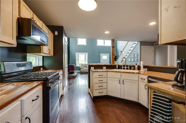 1803 Resor Rd, Fairfield, OH 45014 - kitchen with wood counters, stainless steel gas range oven, a sink, dark wood-type flooring, and a peninsula