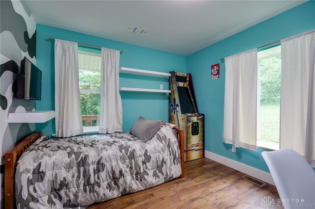 1803 Resor Rd, Fairfield, OH 45014 - bedroom with multiple windows, wood finished floors, and baseboards