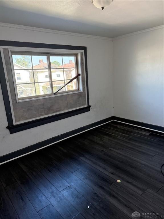 90 S Sperling Ave Unit 88, Dayton, OH 45403 - unfurnished room with wood finished floors, baseboards, and ornamental molding