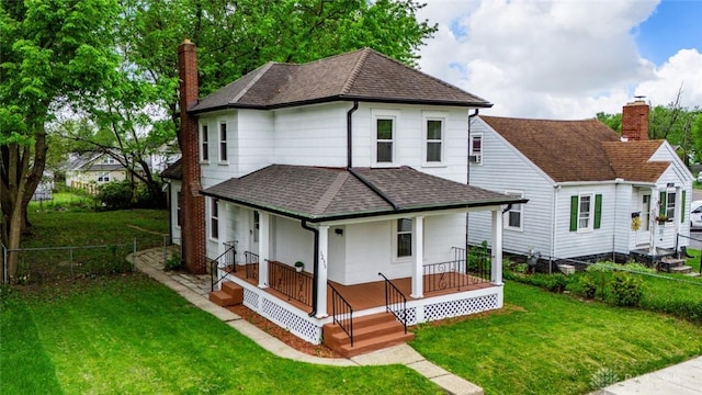 1235 W Jefferson St, Springfield, OH 45506 - rear view of property with roof with shingles, covered porch, and a chimney