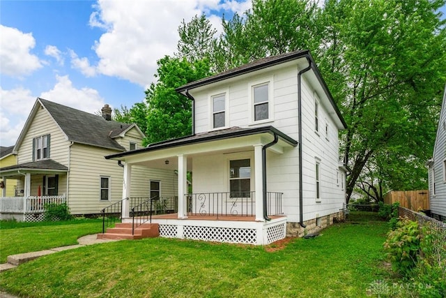 1235 W Jefferson St, Springfield, OH 45506 - american foursquare style home featuring a porch