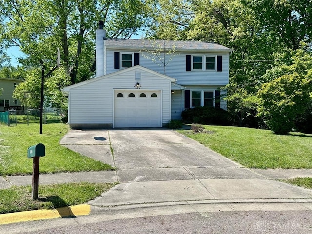 120 Acorn Cir, Oxford, OH 45056 - view of front of house featuring a chimney, concrete driveway, and an attached garage