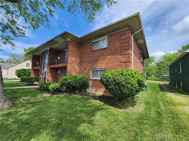2620 N Gettysburg Ave, Dayton, OH 45406 - back of property featuring brick siding and a yard