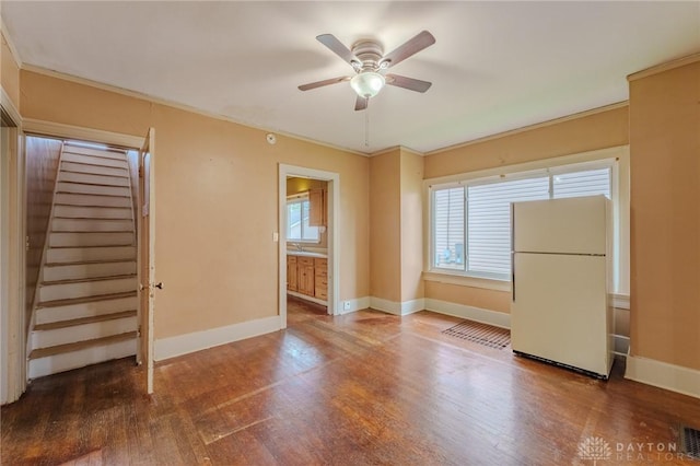 2108 Auburn Ave, Dayton, OH 45406 - spare room with ceiling fan, baseboards, wood finished floors, stairway, and ornamental molding