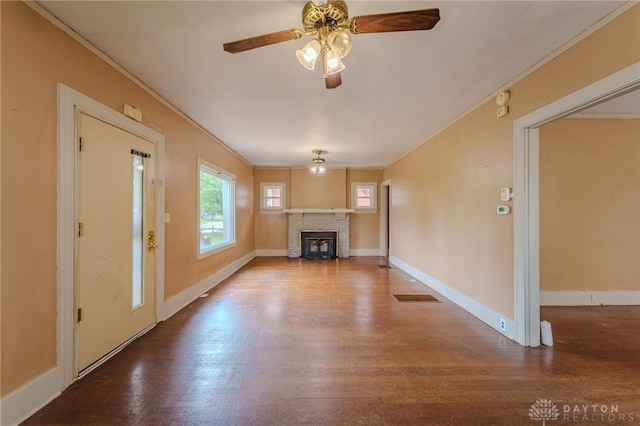2108 Auburn Ave, Dayton, OH 45406 - unfurnished living room with crown molding, wood finished floors, a fireplace, ceiling fan, and baseboards