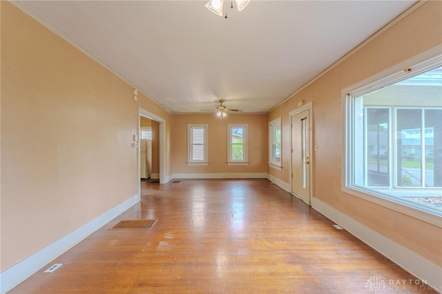 2108 Auburn Ave, Dayton, OH 45406 - empty room featuring a ceiling fan, crown molding, light wood-style floors, and baseboards