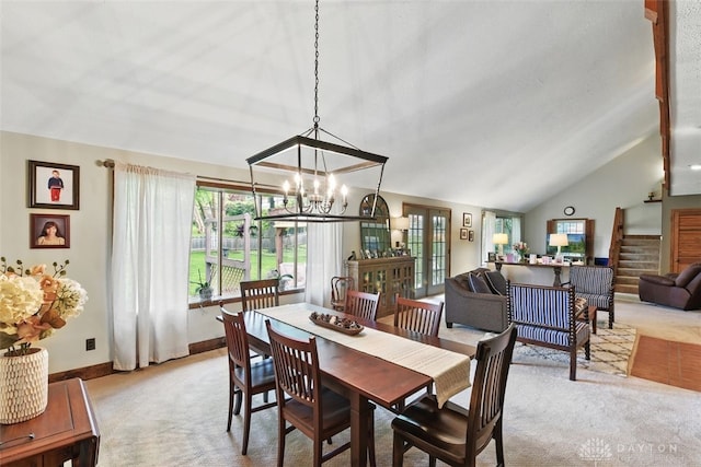 3405 Sherman Ave, Middletown, OH 45044 - carpeted dining room with a chandelier, lofted ceiling, and baseboards