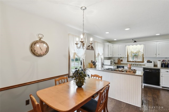 dining room featuring a chandelier, dark wood finished floors, and recessed lighting