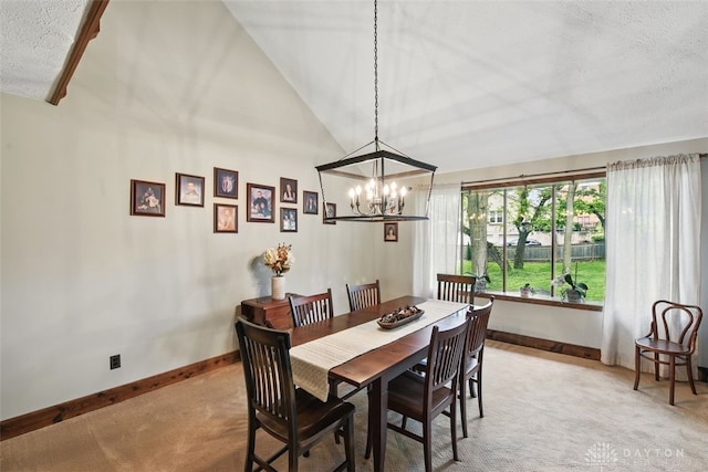 dining area with light colored carpet, vaulted ceiling, baseboards, a chandelier, and a textured ceiling