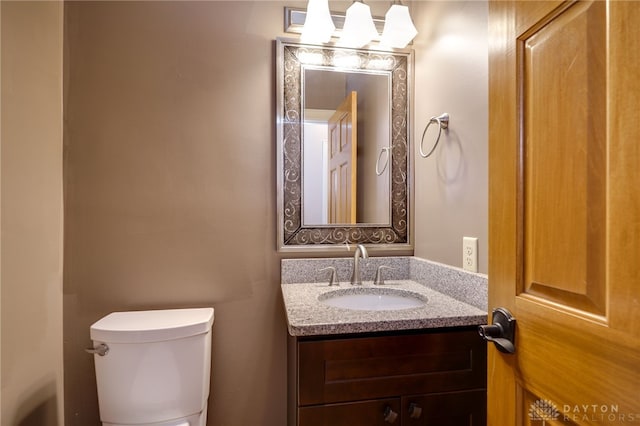 half bath with toilet and vanity
