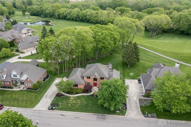 drone / aerial view of a large body of water and a local golf course
