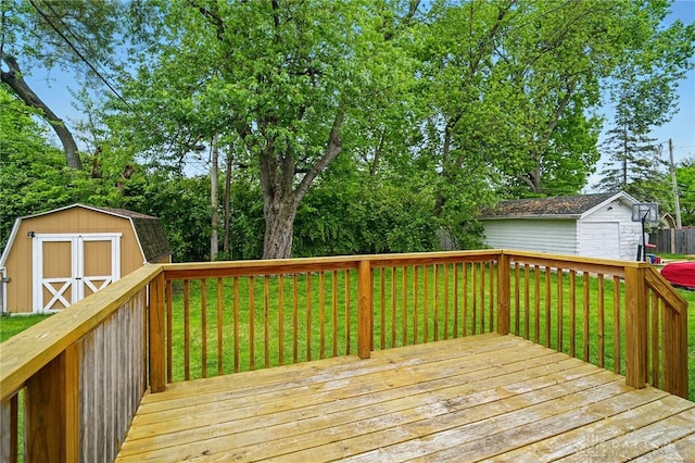 2917 California Ave, Dayton, OH 45419 - wooden deck with an outdoor structure, a lawn, and a storage unit
