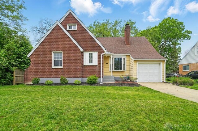 2917 California Ave, Dayton, OH 45419 - view of front facade with a garage, a chimney, driveway, and brick siding