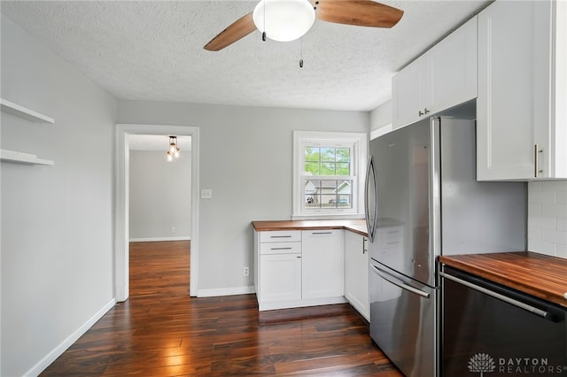 2917 California Ave, Dayton, OH 45419 - kitchen featuring butcher block countertops, freestanding refrigerator, dark wood-type flooring, a textured ceiling, and ceiling fan