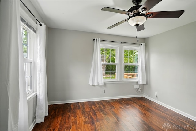 2917 California Ave, Dayton, OH 45419 - empty room with a ceiling fan, dark wood-type flooring, and baseboards