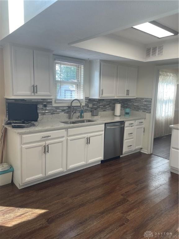 3033 E Linmuth Dr, Springfield, OH 45503 - kitchen with dishwasher, a sink, decorative backsplash, light countertops, and dark wood-type flooring