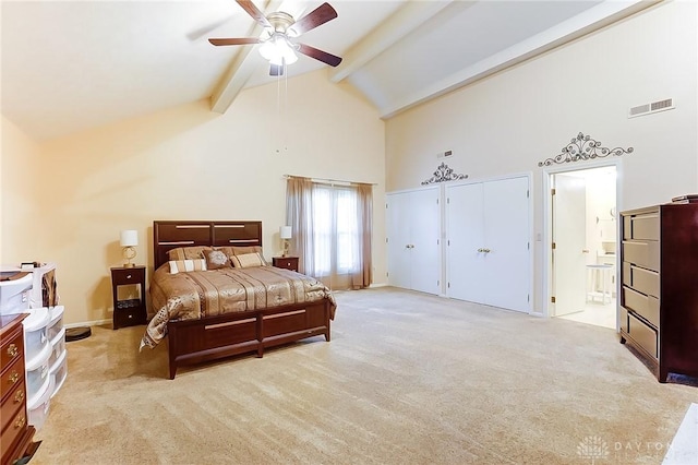3033 E Linmuth Dr, Springfield, OH 45503 - bedroom with high vaulted ceiling, beamed ceiling, light colored carpet, ensuite bath, and two closets