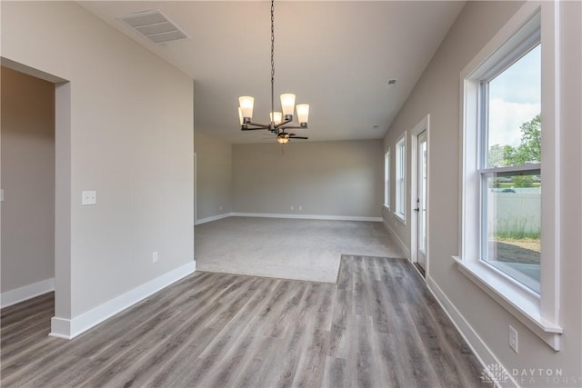 3402 Randall Dr, Cedarville Twp, OH 45314 - unfurnished room with a chandelier and wood finished floors
